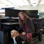 Lynn Gifford, a specialist in trauma stewardship, joins E-Comm as its full-time Workplace Wellness manager along with certified assistance dog Koltan, a four-year-old Yellow Labrador Retriever.